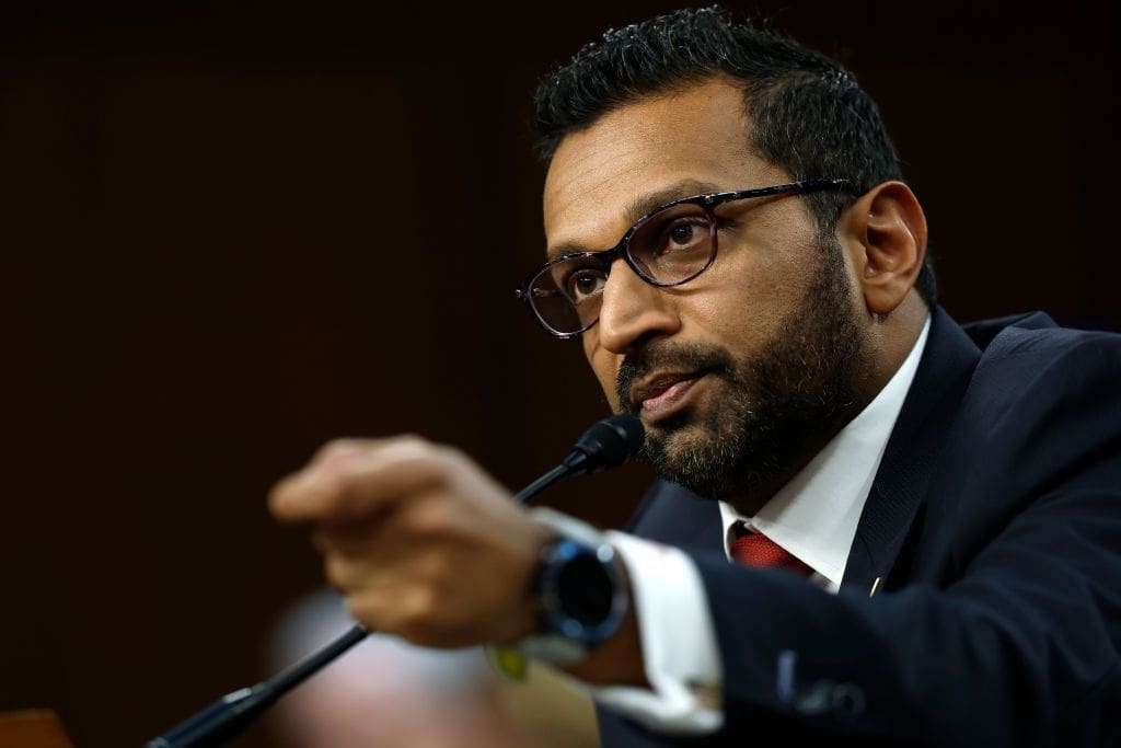 Man speaking into microphone at event