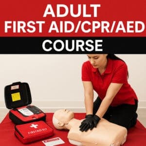 Adult CPR course with mannequin and AED demonstration.